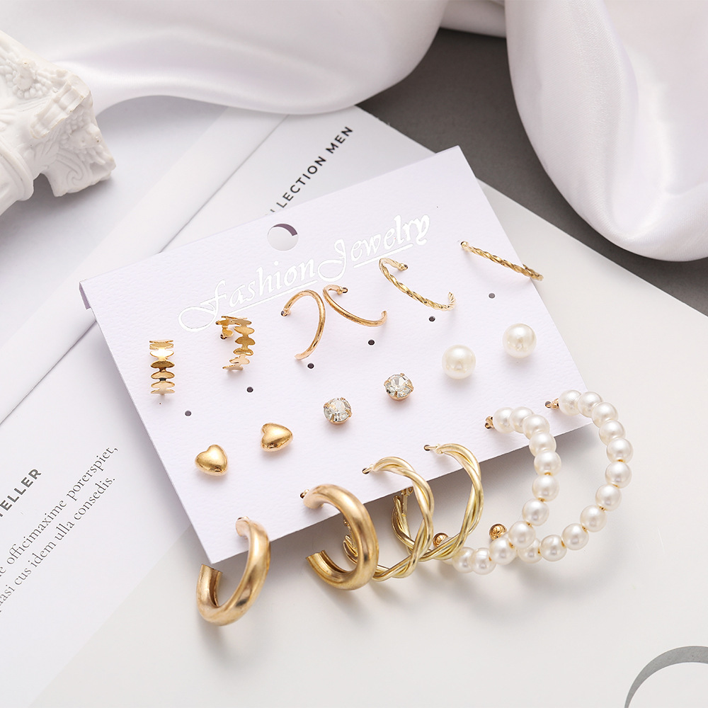 A new 9-piece set of metal twisted letter C ear rings from Europe and America, featuring a creative, retro and simple imitation pearl style Application Scenario