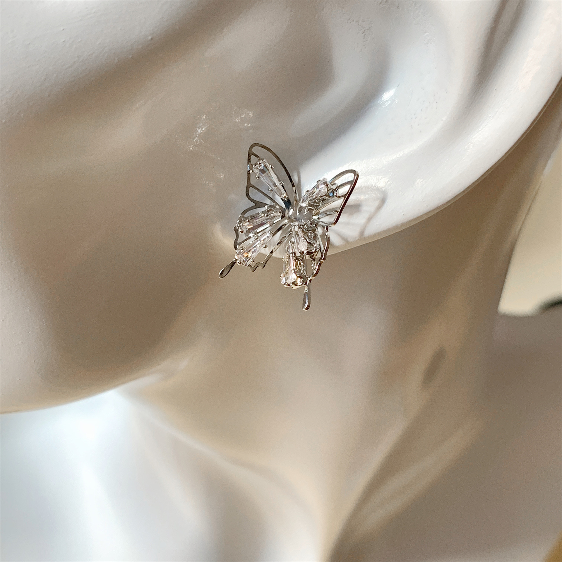 S925 Silver Needle Korean hollowed-out bow Super Flash Zircon, niche style, versatile, high-end design earstud earrings Application Scenario