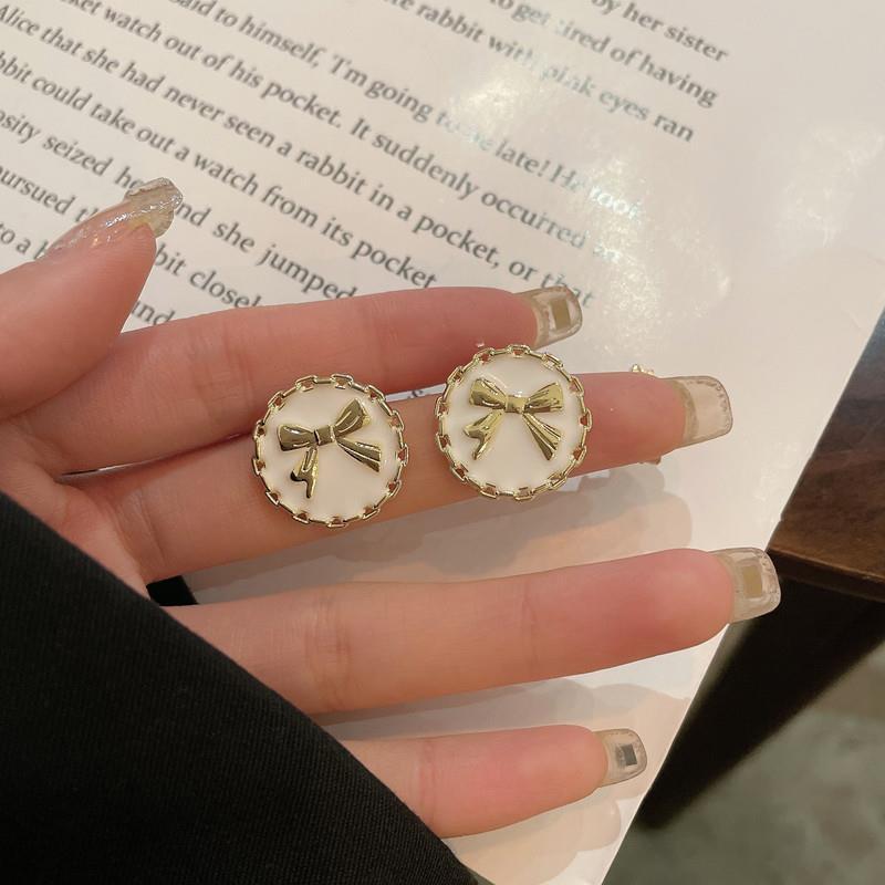 S925 Silver needle Korean cute bow round button stud earrings, forest style retro girl black and white two-color earrings details Picture