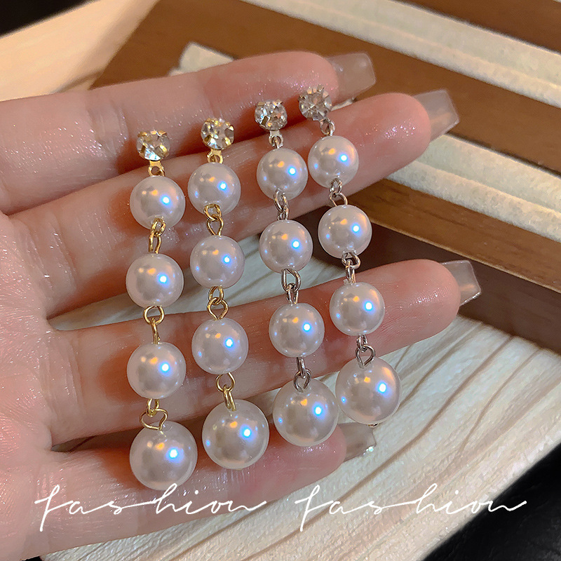 This is a unique and stylish long pearl earring from South Korea. It is a trendy and elegant ear accessory with a simple yet sophisticated look. It features sparkling diamond earrings for women details Picture