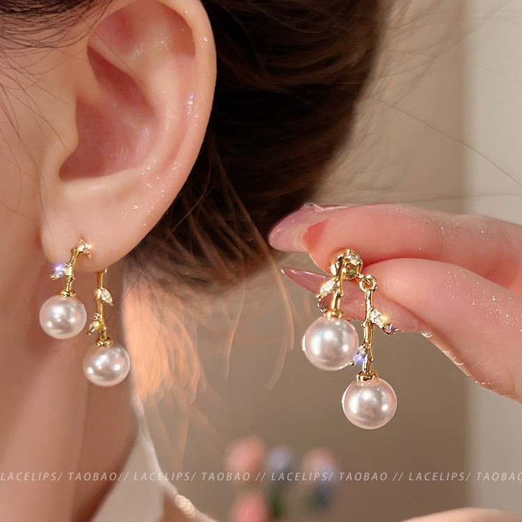 Golden zircon cross-leaf pearl stud earrings, a unique two-pair earring design for women, with a niche and elegant style. Silver needle earrings full figure