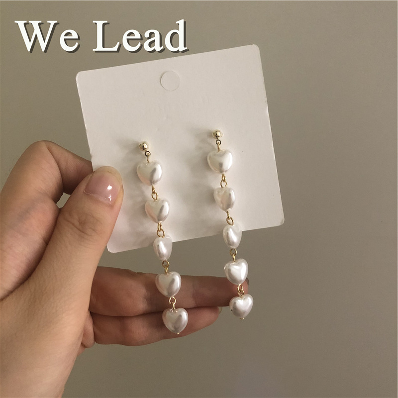 The manufacturer sells long heart-shaped Korean-style tassel earrings with white heart-shaped pearl tassel earrings and elegant bows Specification drawing
