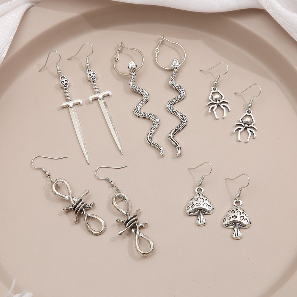 Wholesale of 9-piece retro alloy earrings from Europe and America, featuring creative butterfly, heart, mushroom, snake and spider pendants Application Scenario