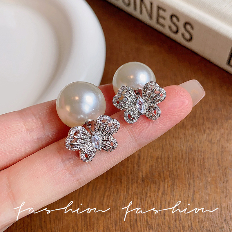The silver exquisite hollowed-out butterfly stud earrings exude a sense of light luxury and high-end elegance. The dual-wear earrings are unique and niche earrings details Picture