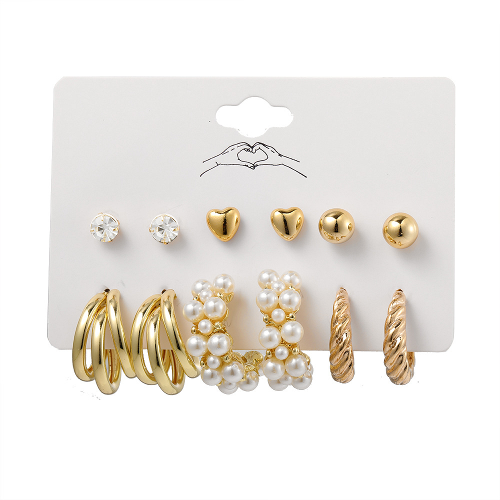 A cross-border bestseller set of 6-piece creative retro golden heart-shaped stud earrings with imitation pearl twist patterns, featuring an Instagram style for women Item Picture