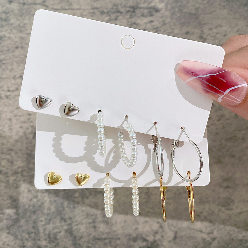 A simple cross-border earring set from Europe and America, featuring 3 pairs of heart-shaped stud earrings and creative, retro and personalized pearl-like ear loops full figure