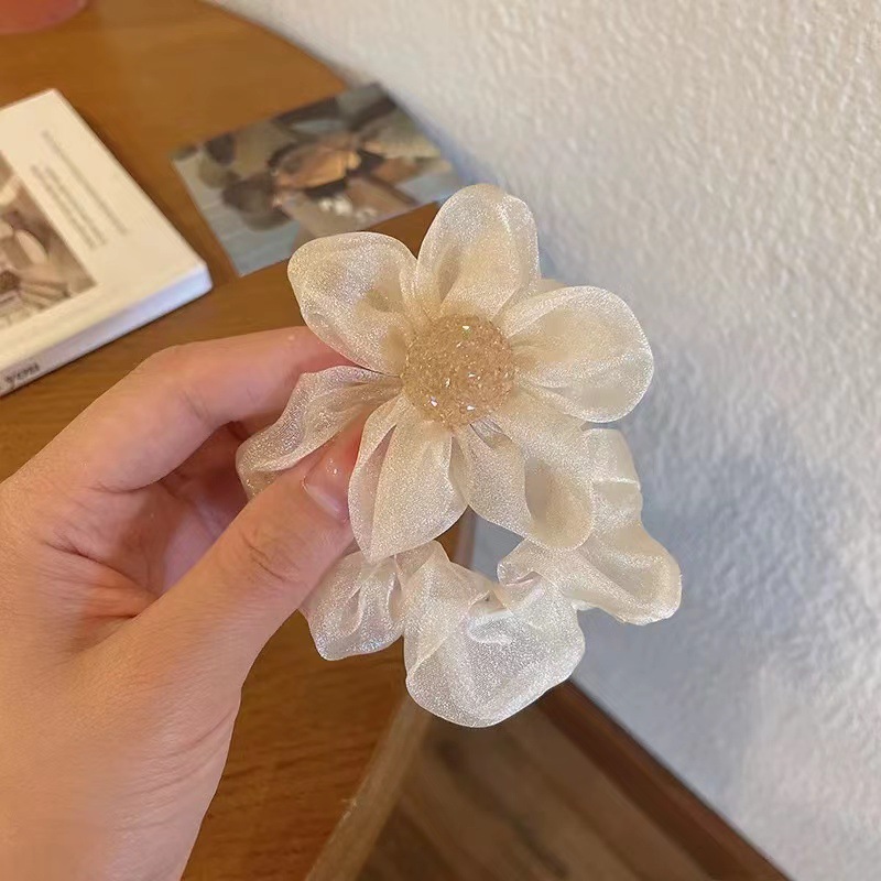 The new trendy hair accessory with a high-end Korean-style flower headband and a feminine charm. The organza large intestine band is used to tie the hair Specification image