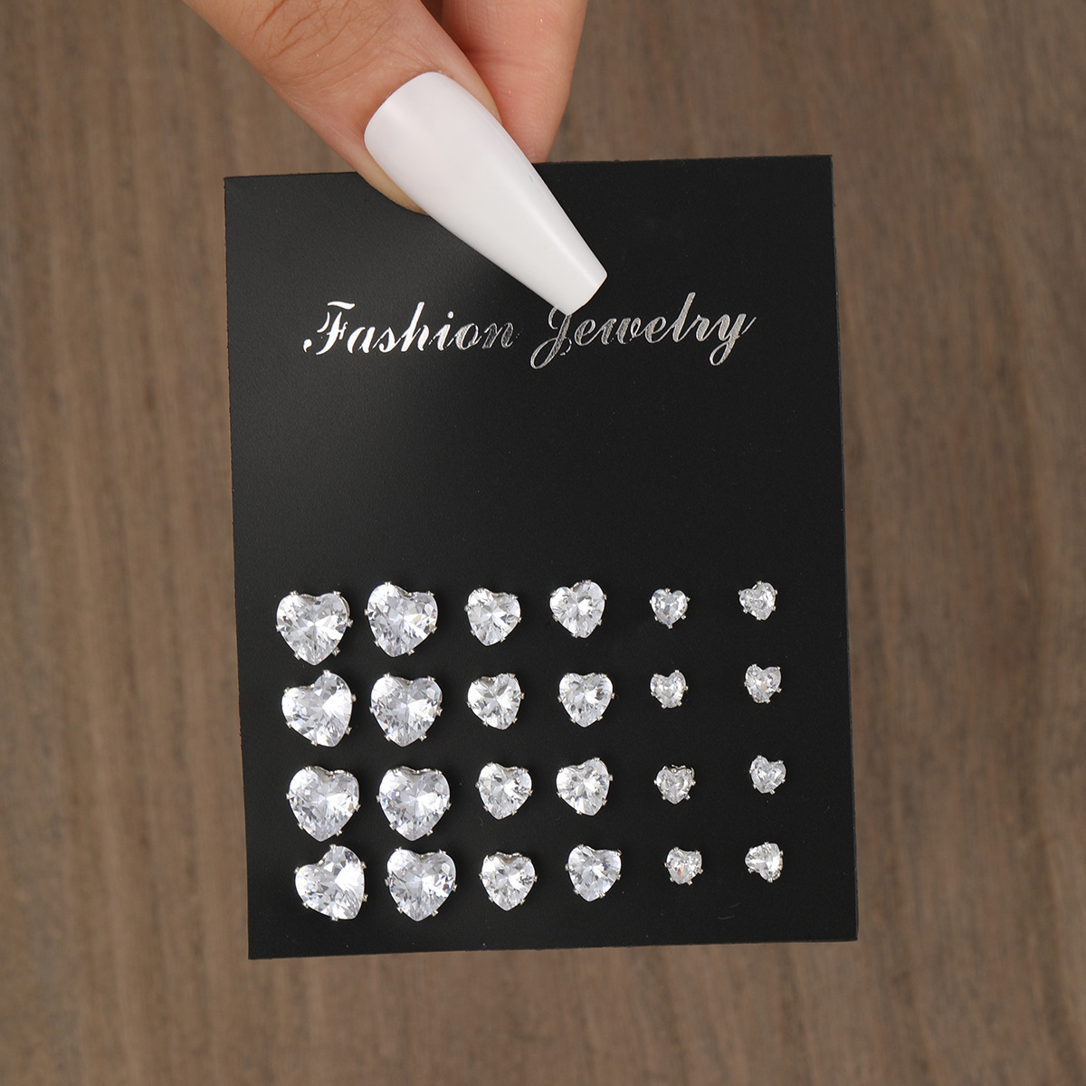 A 12-piece set of new cross-border heart-shaped zircon stud earrings from Europe and America, featuring a fashionable, simple, creative and exquisite design full figure