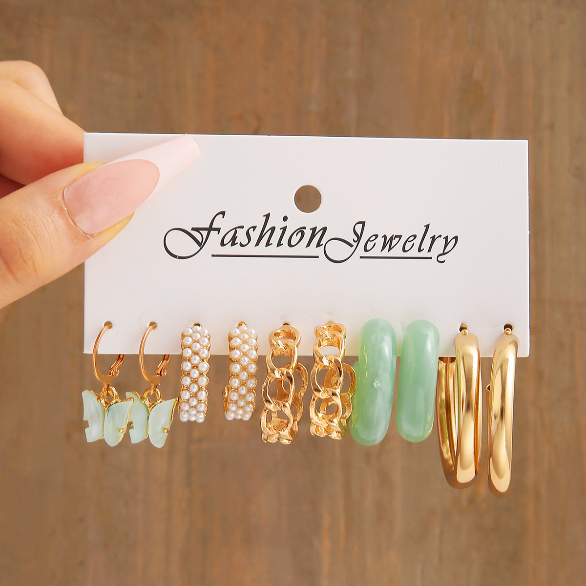 Cross-border new niche design earrings - acrylic butterfly imitation pearl earrings wholesale, European and American metal chain earrings full figure