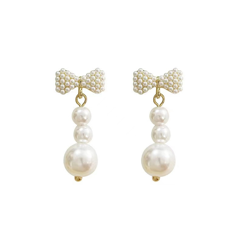 Chanel style bow slightly inlay pearl earrings, silver needle light luxury high-sensitivity earrings, versatile and elegant tassel earrings for women Item Picture
