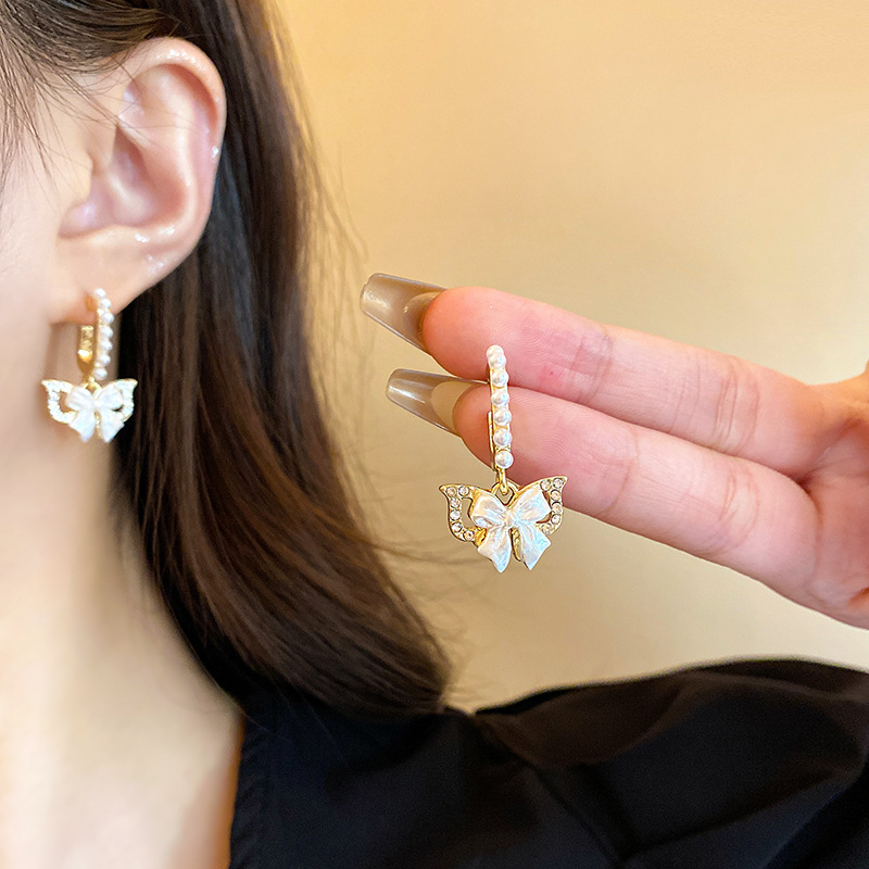 Ins-style silver needle bow earrings, women's light luxury, exquisite and high-end earrings, pearl stud earrings, elegant socialite earrings details Picture