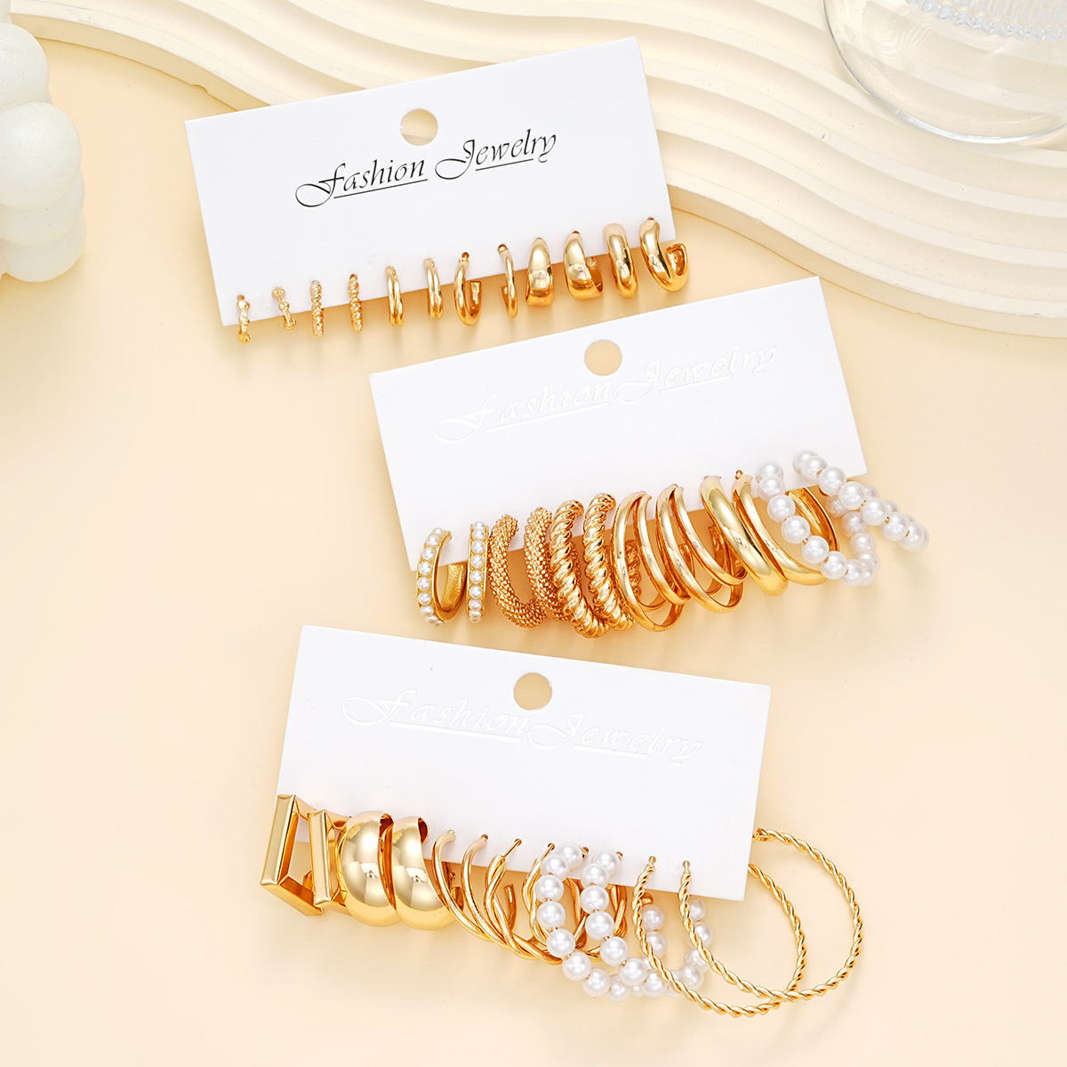 A 18-piece set of popular cross-border geometric imitation pearl twist earrings from Europe and America, a C-shaped light luxury and elegant women's earring set Application Scenario