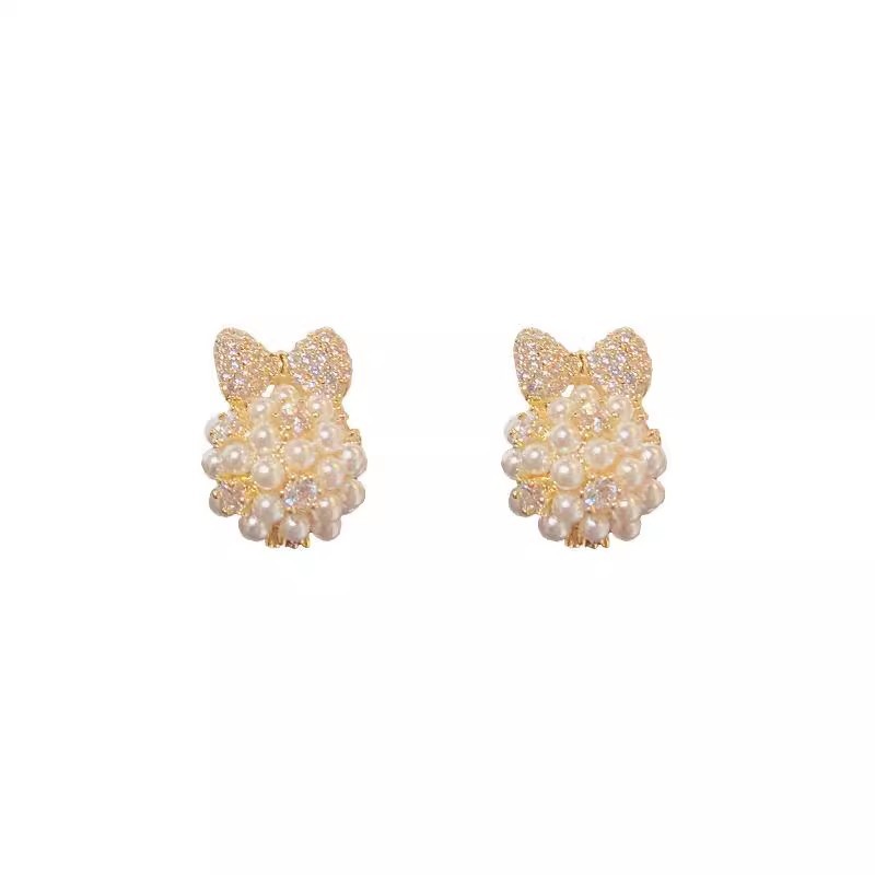 Japanese and Korean pearl bow earrings for women, a light luxury, fashionable and high-end look. The ear studs are a niche design, simple and versatile ear accessory Item Picture