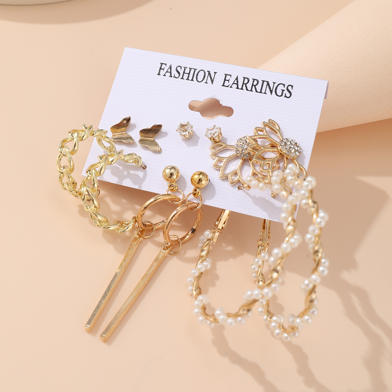 A set of 6 pairs of creative hollowed-out butterfly geometric tassel earrings imitating pearl with cross-border chains from Europe and America Application Scenario