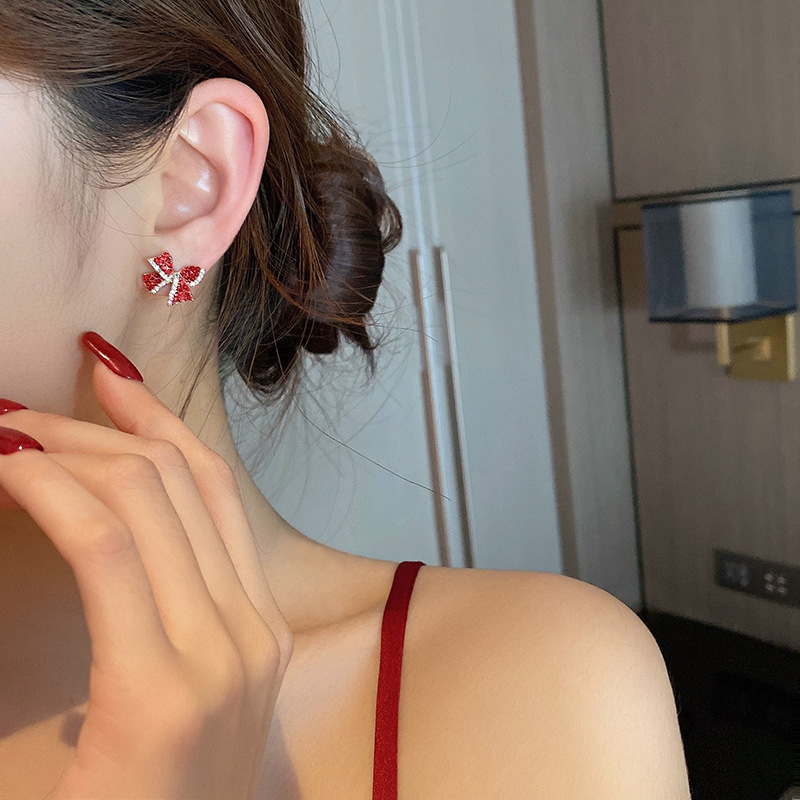 S925 Silver needle red diamond-encrusted personalized bow earrings, a simple and compact earpiece with a cold and aloof style for women, exuding a trendy vibe Application Scenario