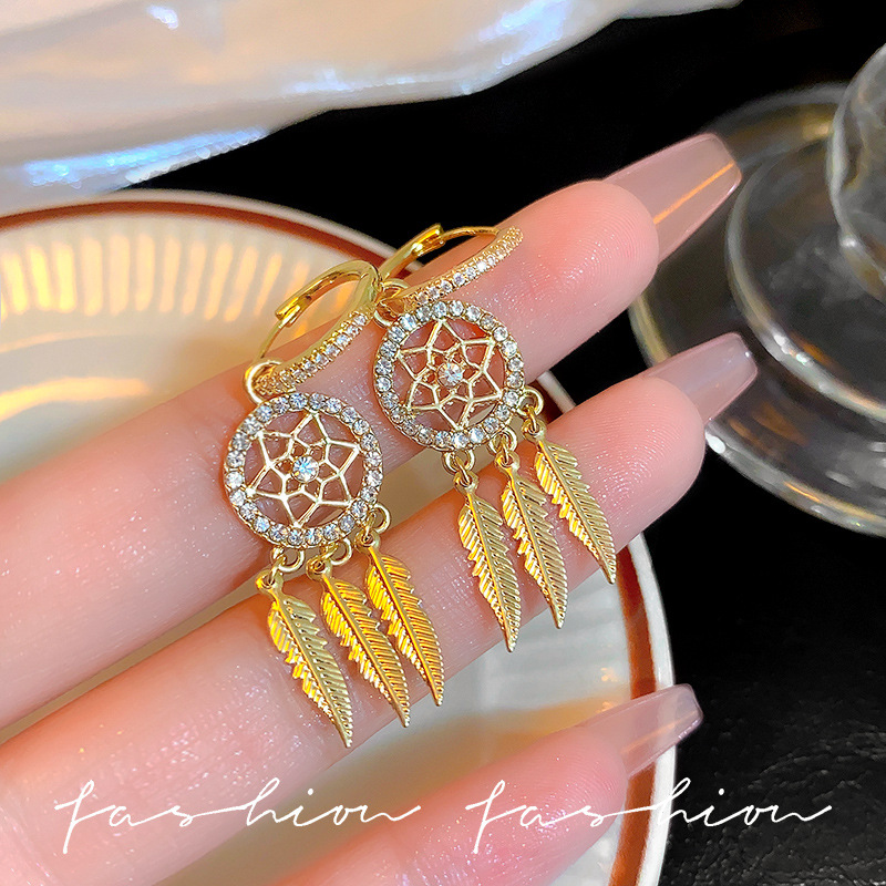 Korean super fairy-like micro-inset zircon feather earrings for women, long and high-end tassel earrings, personalized and elegant earrings wholesale full figure