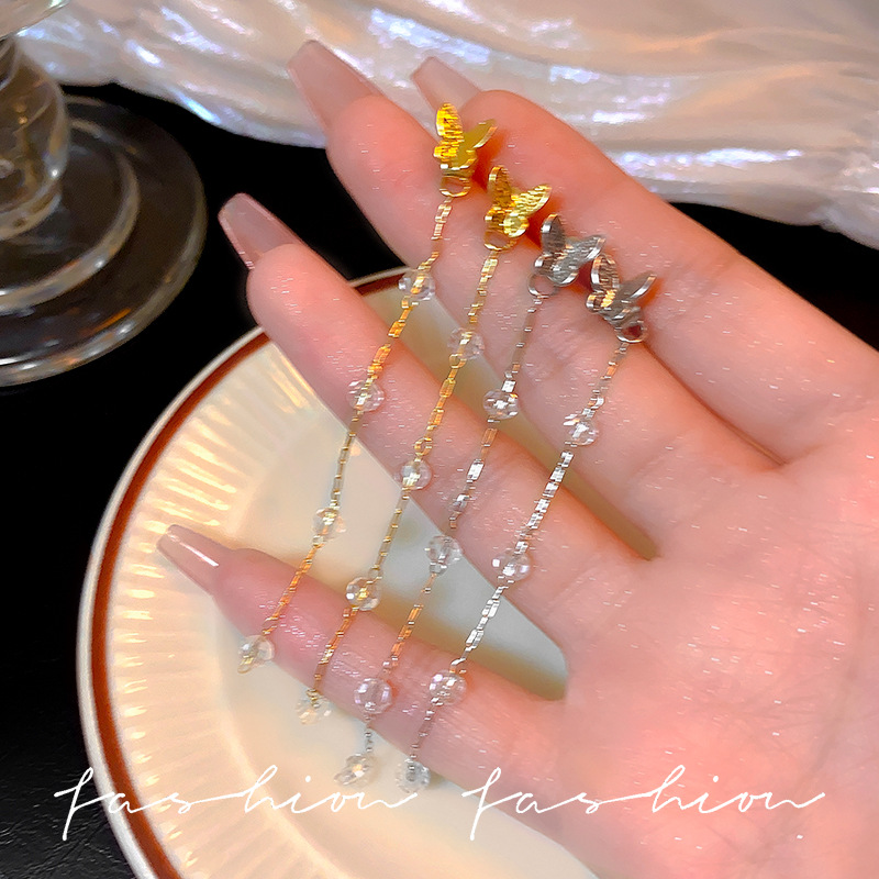 The long fringed butterfly earrings with a cool and refreshing feel, featuring a niche design that slimmers the ear studs, exude an exquisite and light luxury vibe, and are fashionable earrings full figure