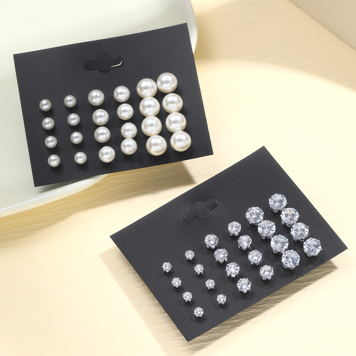 A 24-piece set of retro imitation pearl stud earrings from Europe, America and America, a new cross-border fashion and simple six-prong dot diamond earrings Application Scenario