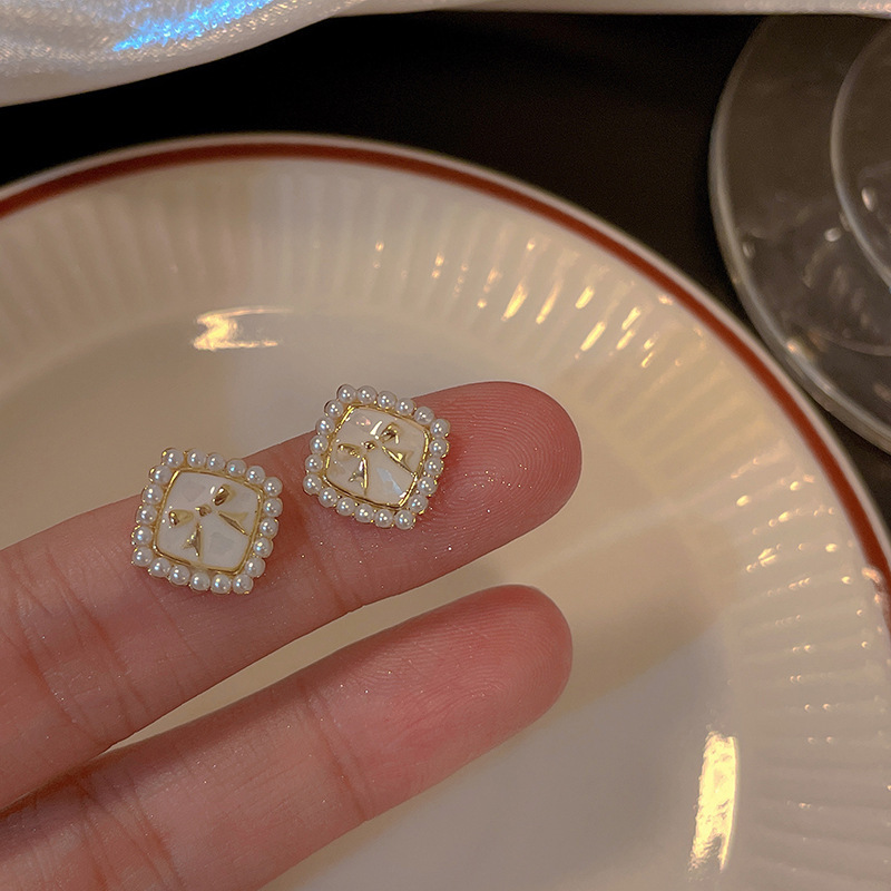 925 Silver needle Bow Pearl Earrings, a niche design for women, with a sweet and elegant style. Wholesale of high-end ear studs Specification drawing