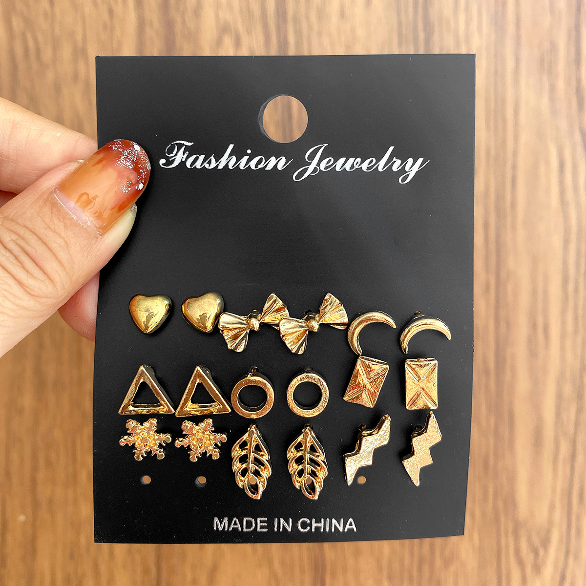New creative and personalized geometric earrings, golden heart triangle, round leaf, moon stud set mixed batch full figure