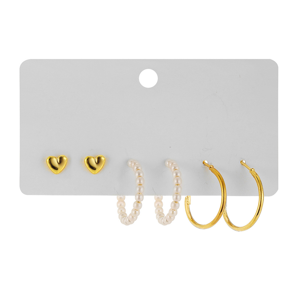 A simple cross-border earring set from Europe and America, featuring 3 pairs of heart-shaped stud earrings and creative, retro and personalized pearl-like ear loops Item Picture