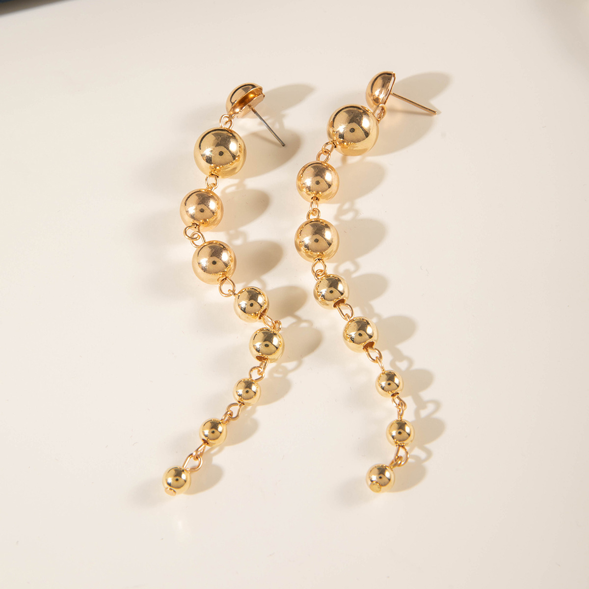 European and American cross-border jewelry, fashionable and retro CCB personalized metal round bead geometric tassel long earrings and pendants for women details Picture
