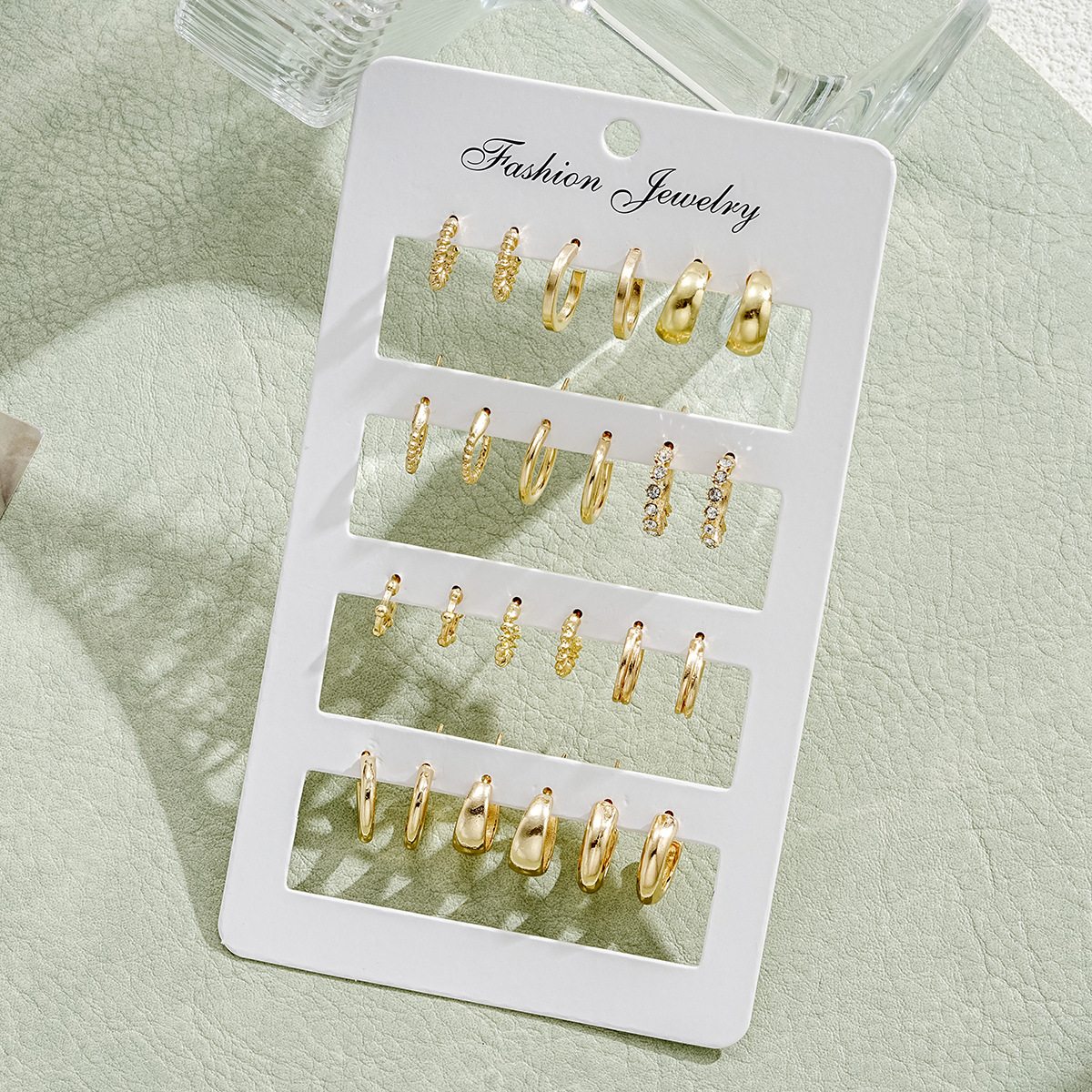 A 12-piece set of cross-border new European and American style creative C-shaped point diamond earrings, a fashionable accessory with a high-end feel full figure