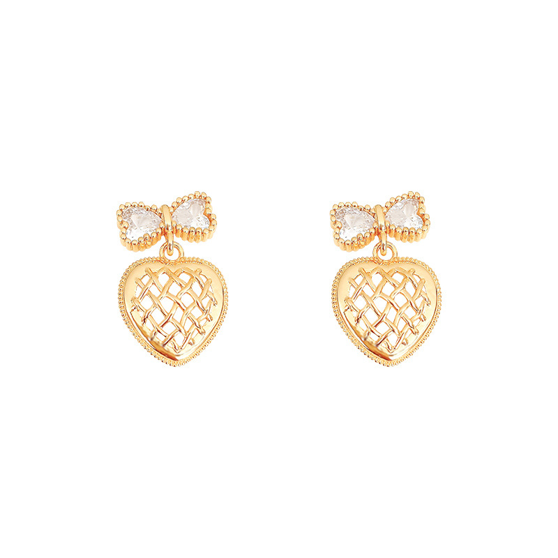 Wholesale of light luxury bow earrings with a sense of design, hollowed-out heart, elegant stud earrings and versatile earrings from Dongdaemun, South Korea Item Picture