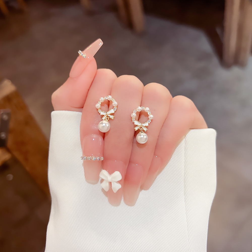 S925 Silver needle unique bow pearl daily stud earrings, women's light luxury earrings, niche design sense earrings full figure