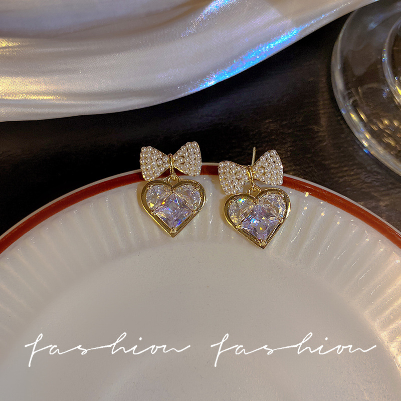 Silver needle pearl bow zircon heart-shaped earrings, cold style, niche design sense, simple and individual stud earrings for women Specification drawing