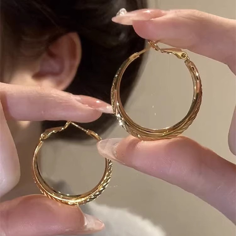 Cold style striped braided silver needle ear rings for women, unique and individualistic plain ring earrings, fashionable and elegant ring earrings details Picture
