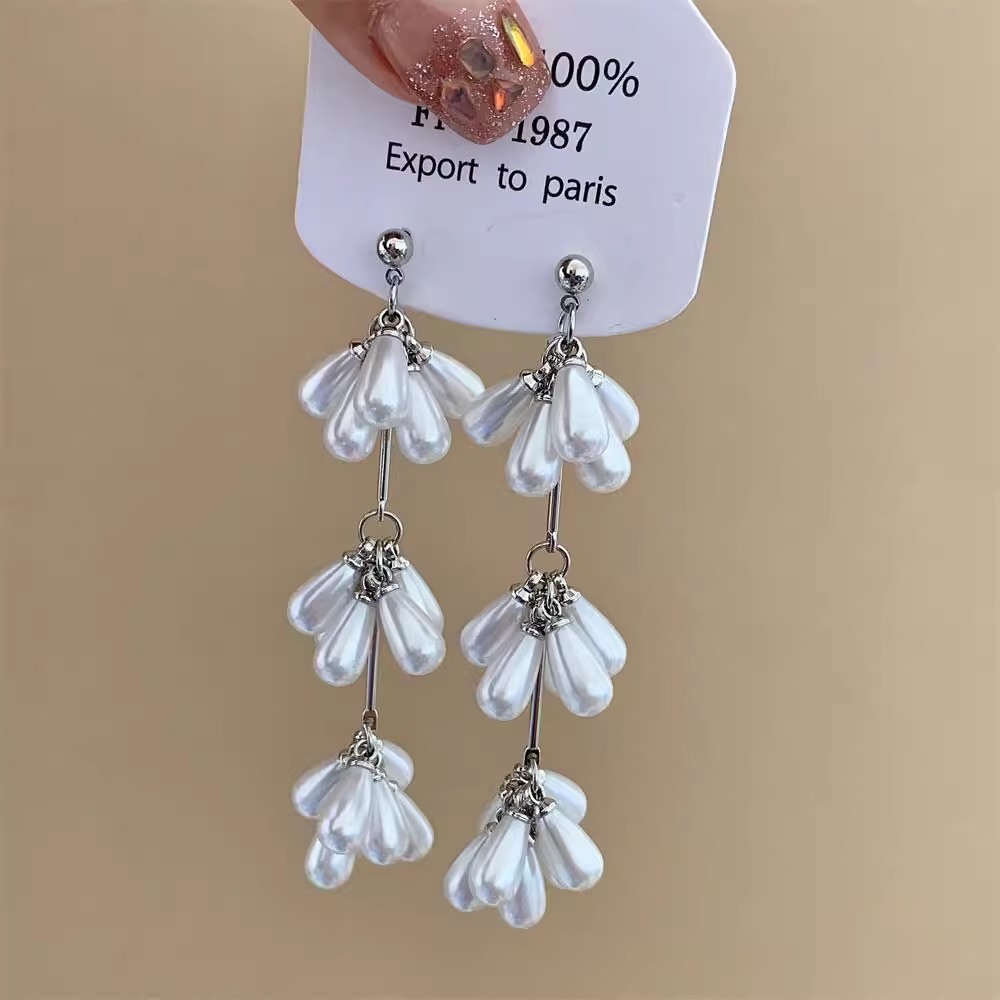 French white long tassel flower stud earrings with a unique design sense for women, exuding a high-end and distinctive charm Application Scenario