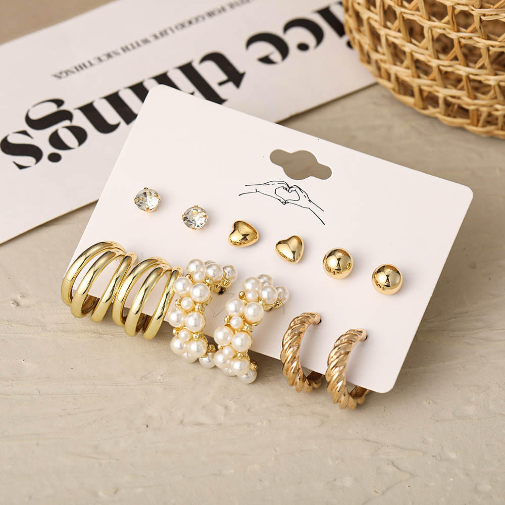 A cross-border best-selling set of 6-piece creative and retro golden heart-shaped earrings imitating pearl twist patterns for elegant women Application Scenario