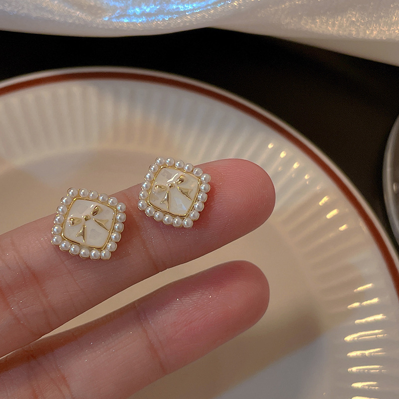 925 Silver needle Bow Pearl Earrings, a niche design for women, with a sweet and elegant style. Wholesale of high-end ear studs full figure