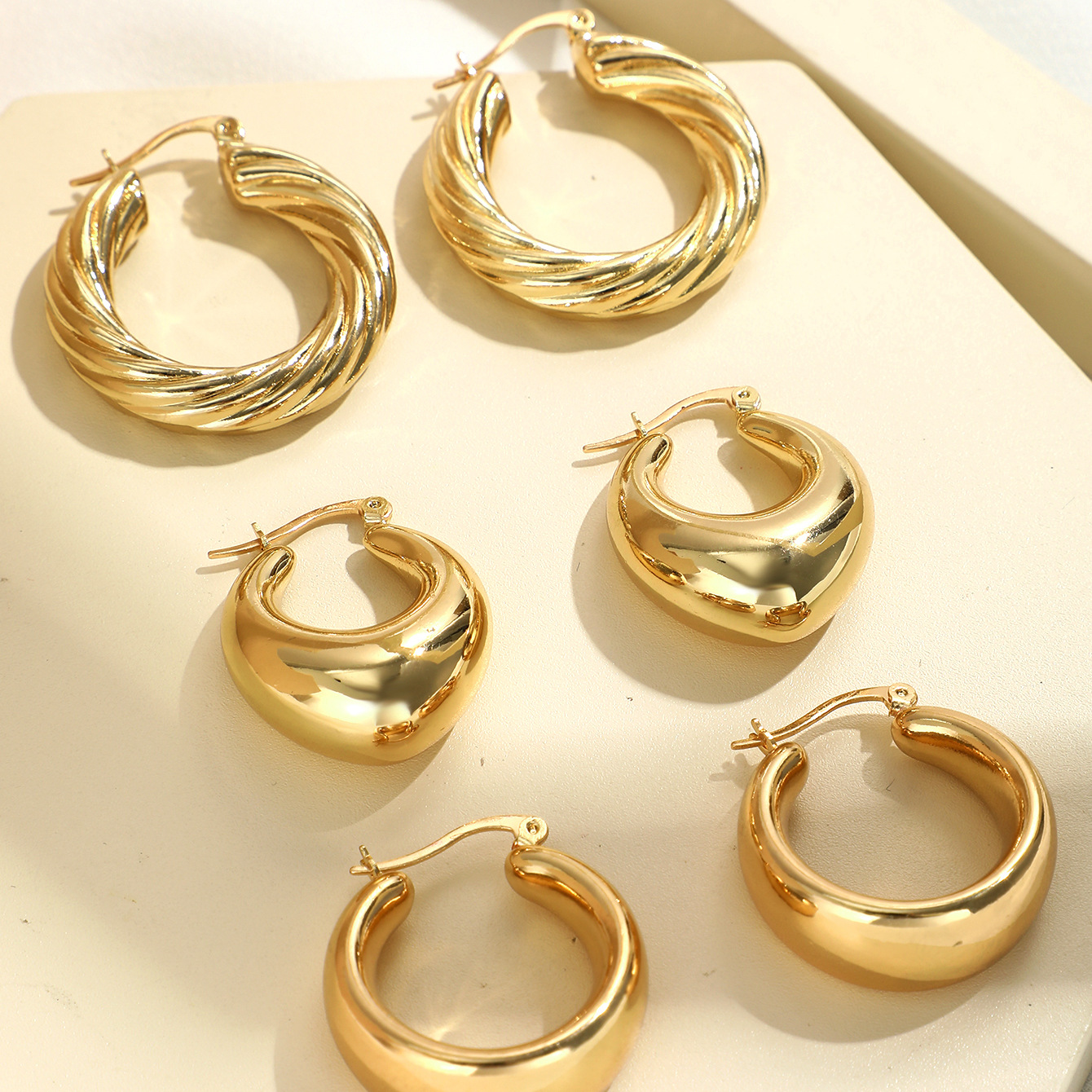 Cross-border high-end women's European and American style geometric hollow smooth earrings, European and American style water drop bean gold earrings set details Picture