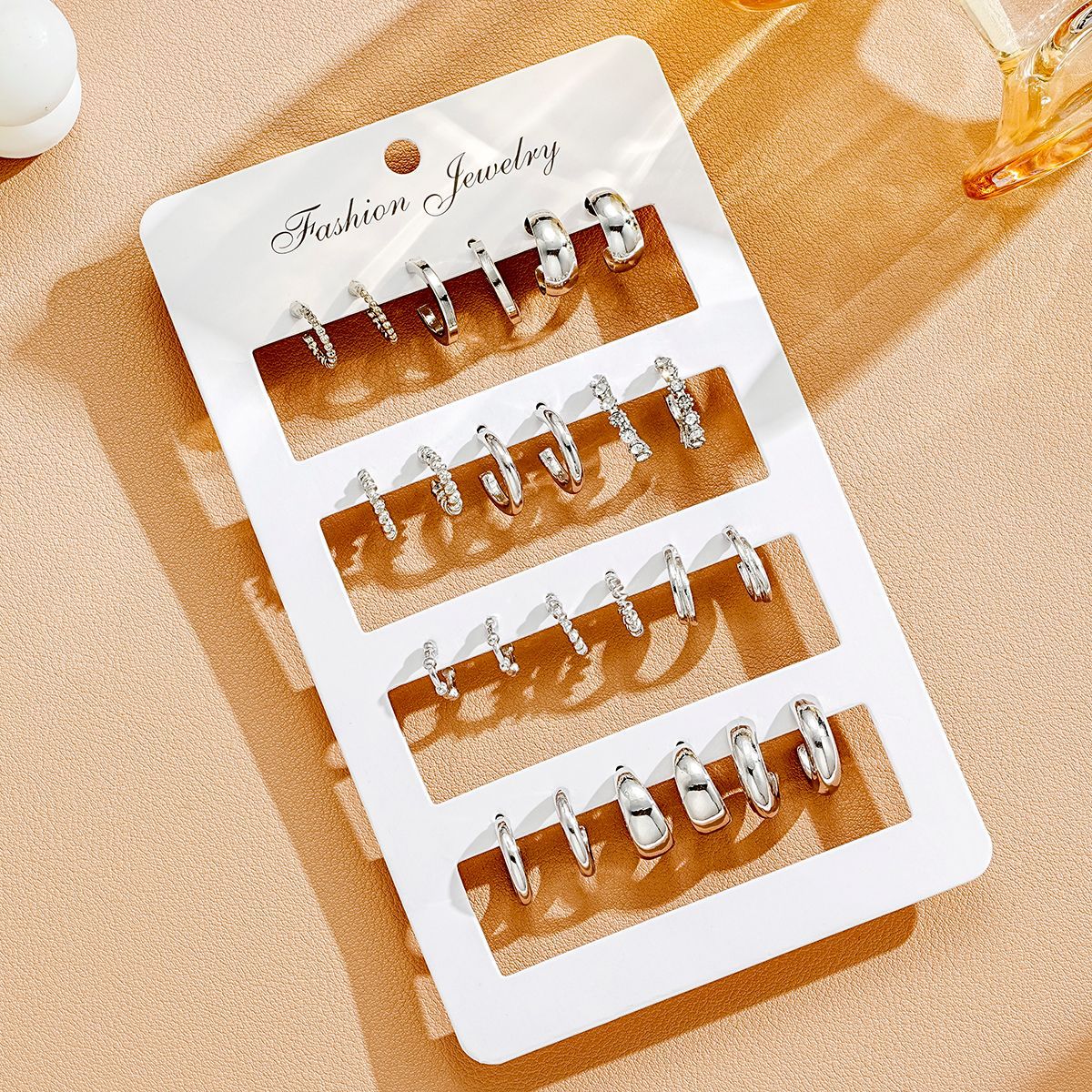 A 12-piece set of cross-border new European and American style creative C-shaped point diamond earrings, a fashionable accessory with a high-end feel Application Scenario