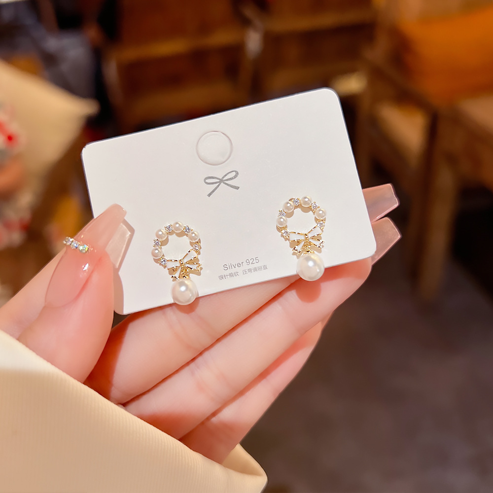 S925 Silver needle unique bow pearl daily stud earrings, women's light luxury earrings, niche design sense earrings details Picture