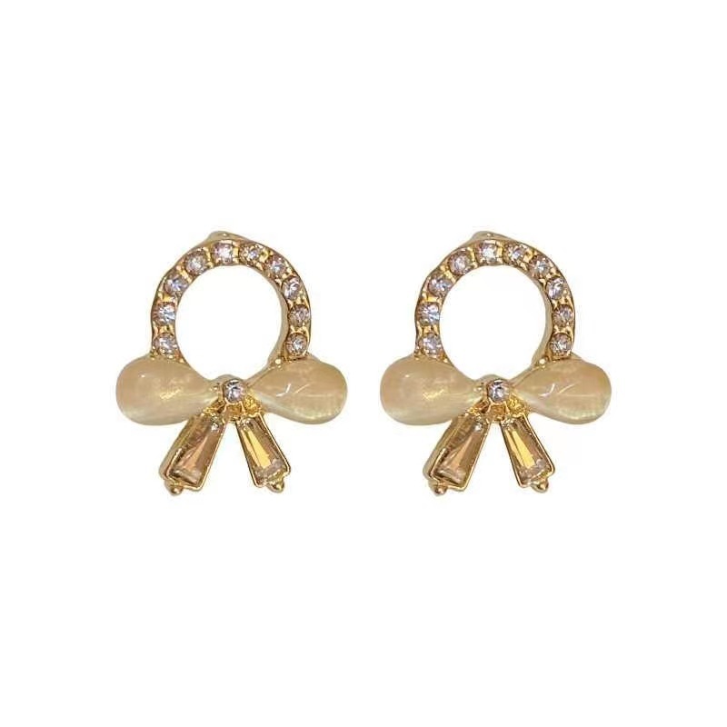 S925 Silver Needle New cat's eye stone bow stud earrings for women, small, simple and versatile Korean earrings, trendy and stylish for going out Item Picture