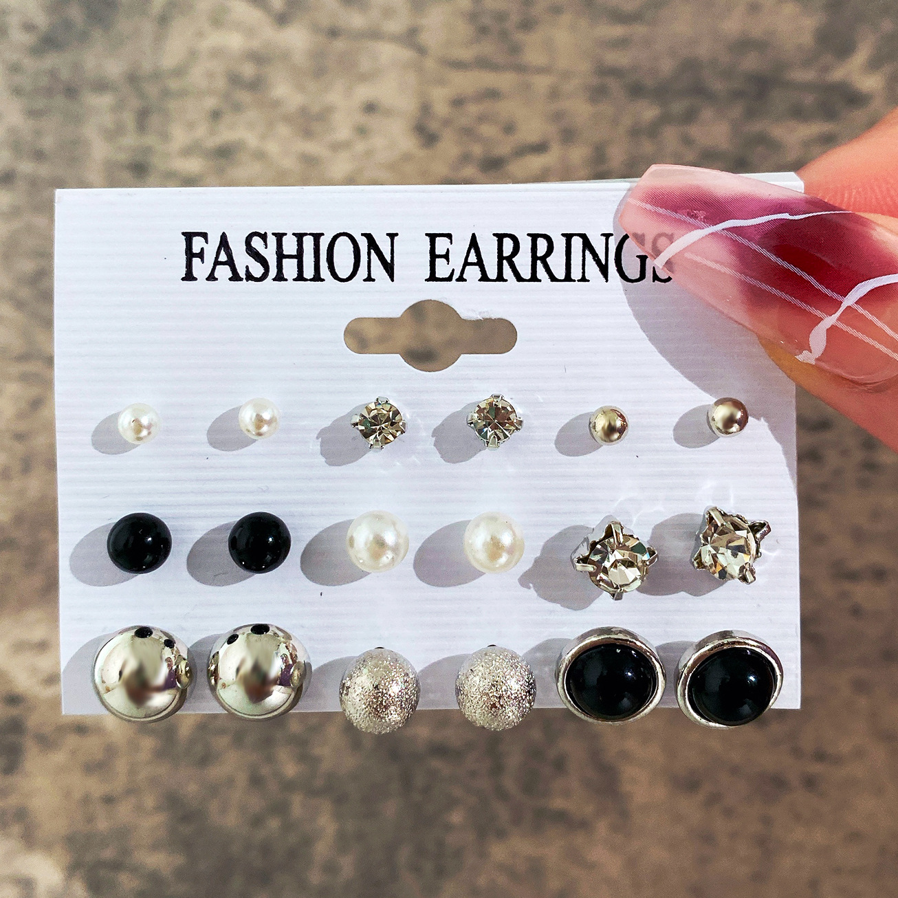 Wholesale of new cross-border ear stud sets of 9 pairs, creative, retro and simple artificial pearl black resin earrings from Europe and America full figure