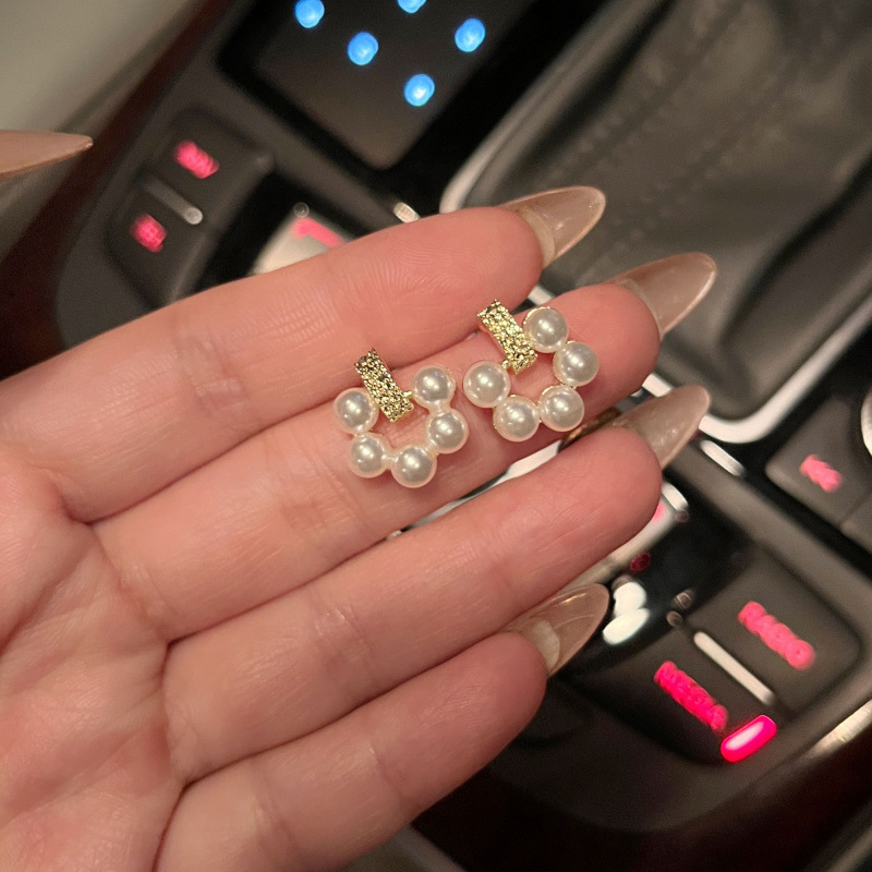 Simple and versatile pearl stud earrings, new floral, niche design, net-like elegance, silver needle earrings for women details Picture