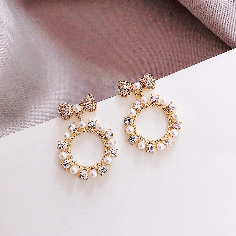 S925 Silver Needle Sweet and Fashionable circle pearl bow Tie Earrings, Korean-style bow tie small and versatile ears full figure