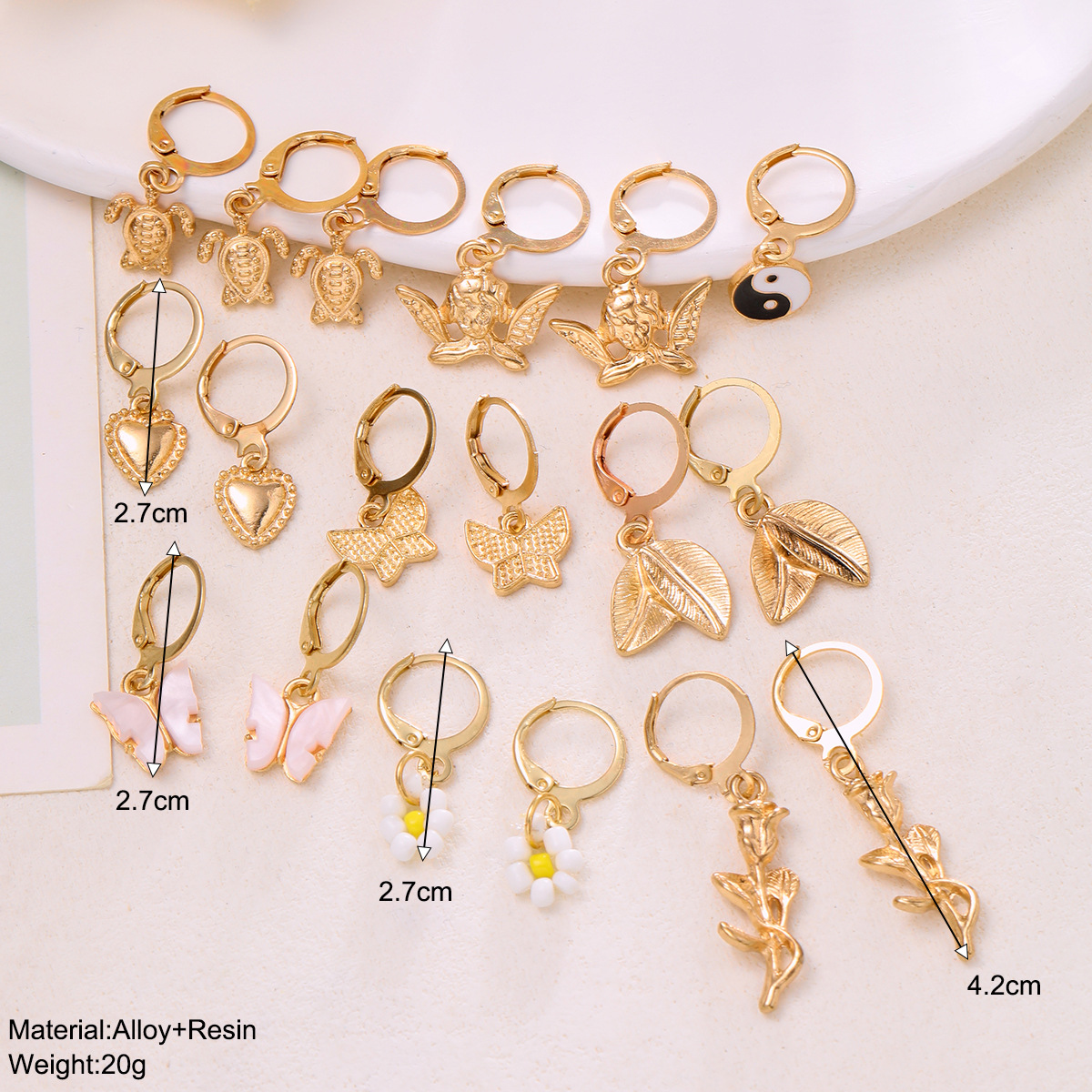 A new cross-border alloy-inlaid rhinestone earring set from Europe and America, featuring 9 pairs of creative butterfly, turtle, Tai Chi and flower earrings details Picture