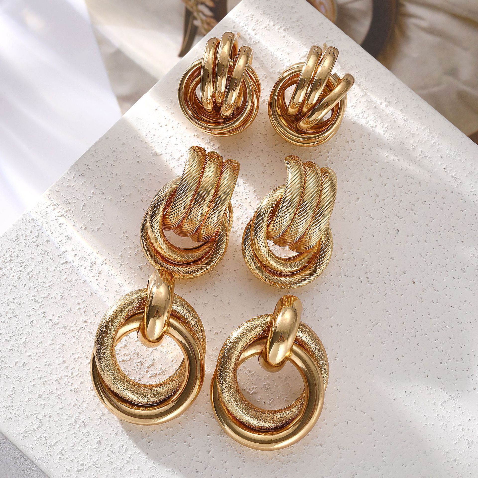 Cross-border European and American earrings, gold retro texture, elegant multi-layer twist earrings, individual, exaggerated and creative earring set Application Scenario