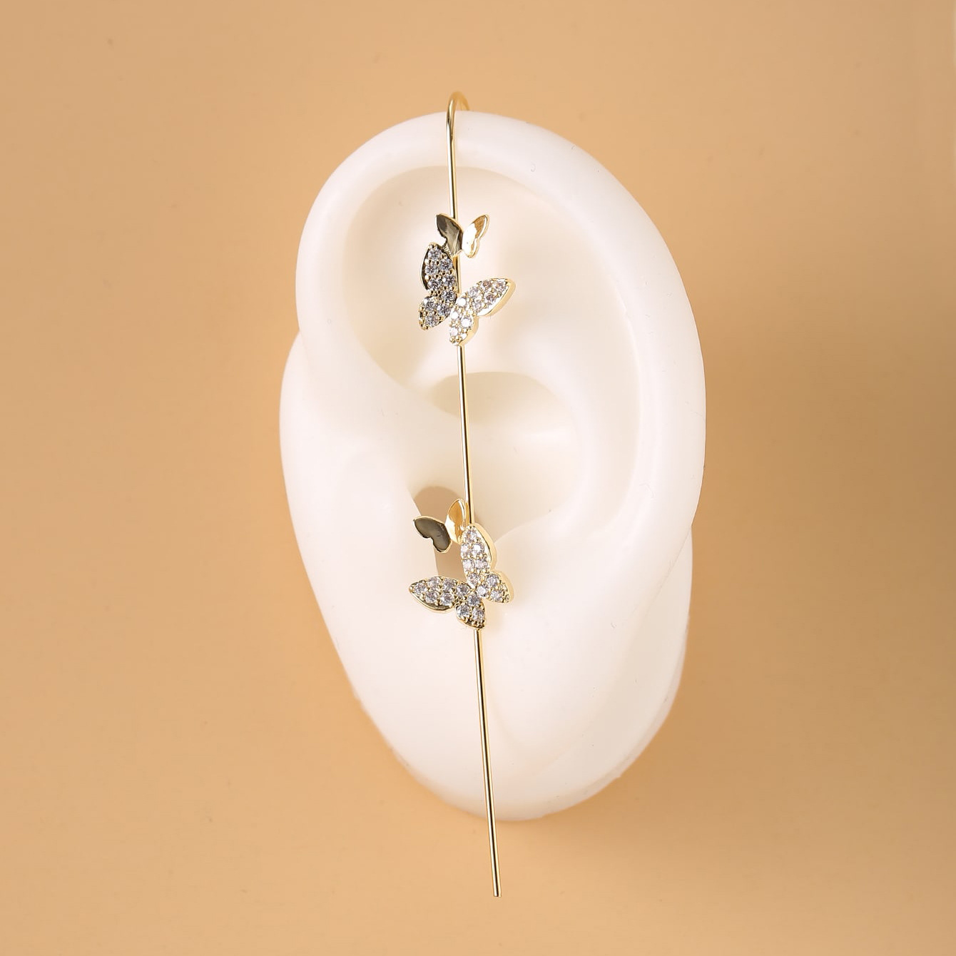 European and American cross-border embedded water diamond ear hooks, piercing ear needles, women's design, butterfly-shaped oblique line ear studs around the auricle, unique Application Scenario
