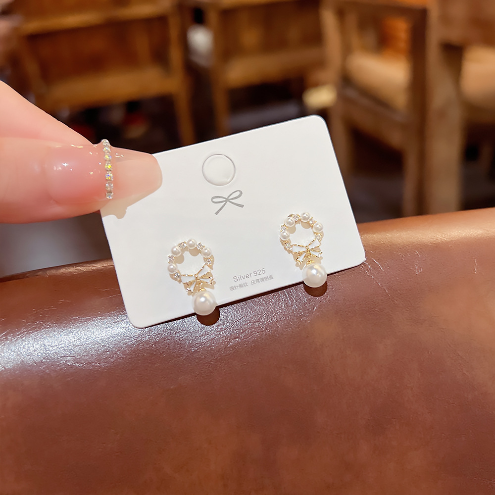 S925 Silver needle unique bow pearl daily stud earrings, women's light luxury earrings, niche design sense earrings Specification drawing