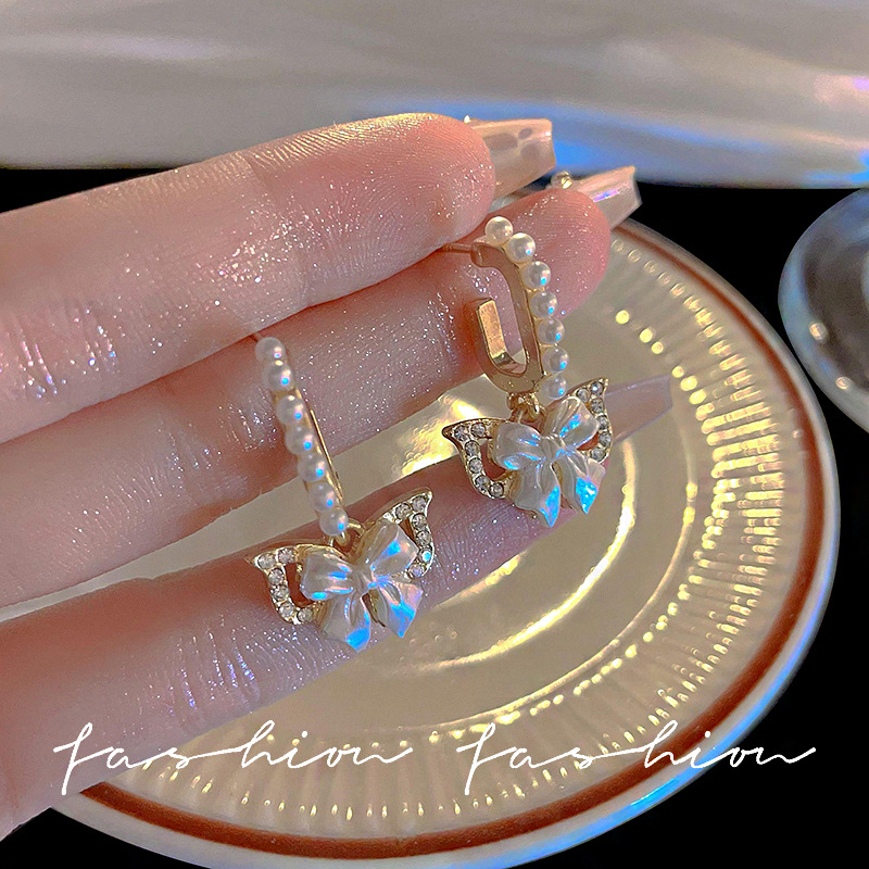 Ins-style silver needle bow earrings, women's light luxury, exquisite and high-end earrings, pearl stud earrings, elegant socialite earrings full figure