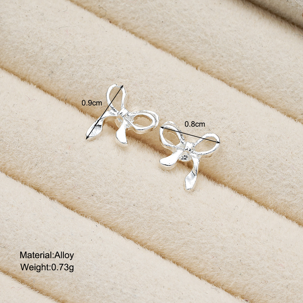 The popular cross-border bow stud earrings for women in Europe and America feature a simple and cold style, a trendy and niche design with a sense of hollowed-out style details Picture