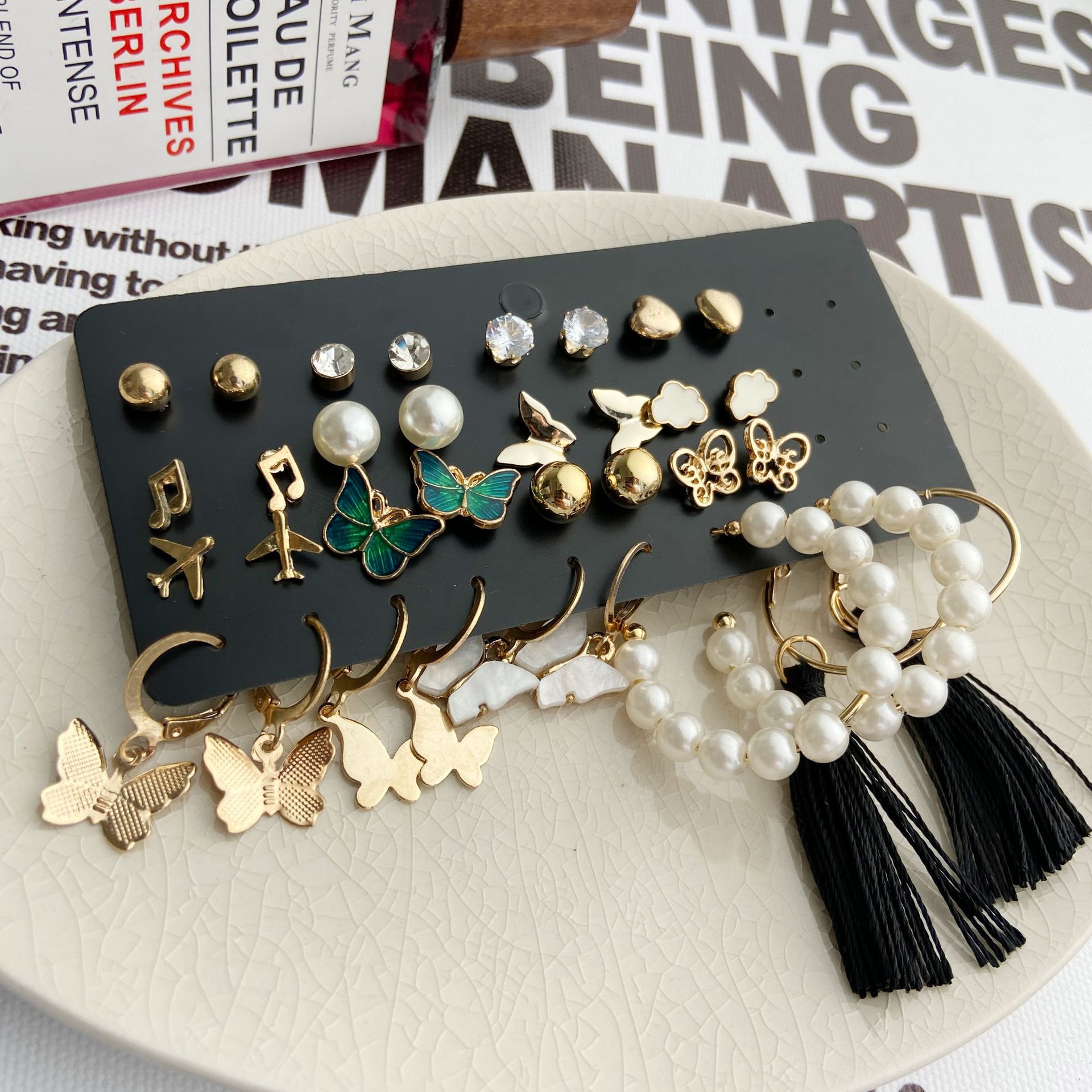 A 17-piece set of creative and retro gold butterfly airplane tassel earrings with imitation pearl inlays from Europe and America details Picture