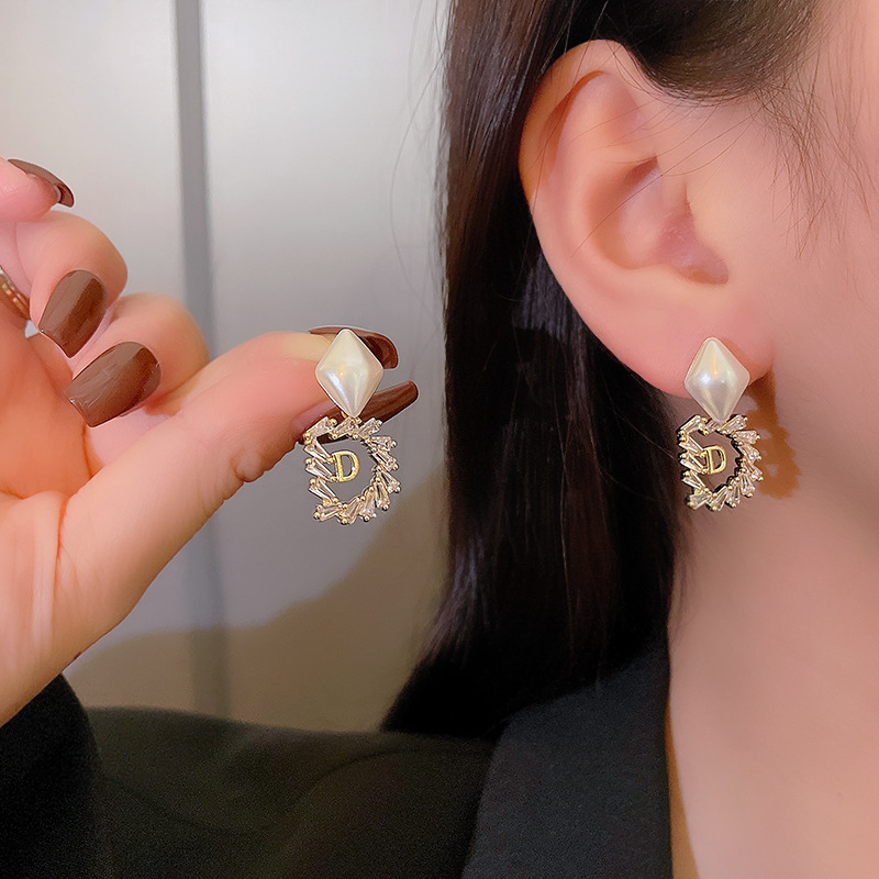 s925 Silver Needle, elegant, fashionable and exquisite letter pearl stud earrings, female Internet celebrity, super dazzling personality, niche design sense earrings Application Scenario