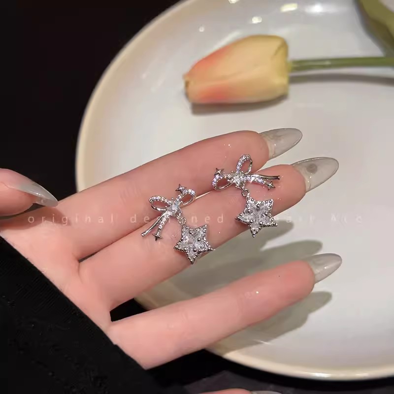 Silver needle micro-inlay bow star earrings, sweet and cool for girls, versatile stud earrings, Korean-style temperament, Internet celebrity personality earrings details Picture